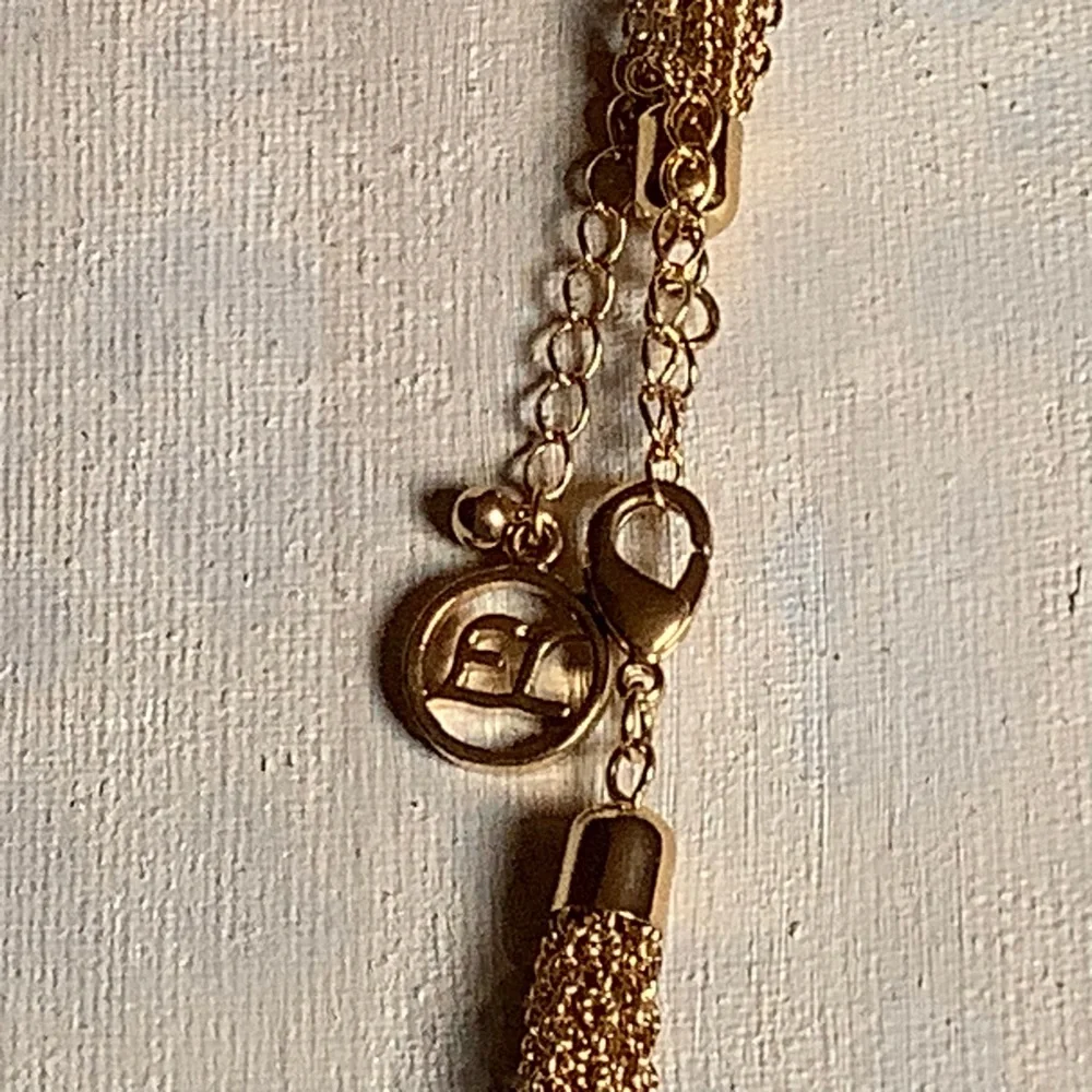 EL by Erica Lyons Gold Tone Long Knotted Statement Necklace 41-45 Inches Adjust